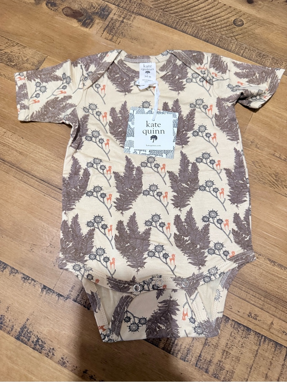 Kate Quinn short sleeve bodysuit in the Caramel Unicorn print, size 3–6M